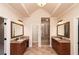 Spacious bathroom with double sink vanities, granite countertops, and a glass-enclosed shower with tile surround at 1837 Haven Park Se Cir, Smyrna, GA 30080