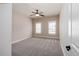 Neutral bedroom with two windows, ceiling fan, and carpet at 1837 Haven Park Se Cir, Smyrna, GA 30080