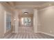 Elegant bedroom featuring carpeted floors, natural light from large windows, and classic architectural columns at 1837 Haven Park Se Cir, Smyrna, GA 30080