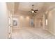 Spacious bedroom with tray ceilings, a ceiling fan, neutral paint and carpet, and large windows for natural light at 1837 Haven Park Se Cir, Smyrna, GA 30080
