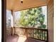 A peaceful outdoor deck features wooden railings and flooring, with a beautiful view of lush green trees at 1837 Haven Park Se Cir, Smyrna, GA 30080
