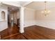Elegant dining room with hardwood floors, classic wainscoting, and a decorative chandelier at 1837 Haven Park Se Cir, Smyrna, GA 30080