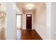 Spacious entryway with hardwood floors, white wainscoting, and elegant trim details at 1837 Haven Park Se Cir, Smyrna, GA 30080