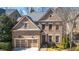 Beautiful brick home with a two-car garage, trimmed lawn, and distinguished architectural design at 1837 Haven Park Se Cir, Smyrna, GA 30080