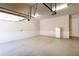 This spacious two-car garage has epoxy floors and a full-size fridge at 1837 Haven Park Se Cir, Smyrna, GA 30080