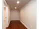 Bright hallway featuring gleaming hardwood floors and neutral paint, creating a welcoming space at 1837 Haven Park Se Cir, Smyrna, GA 30080
