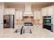 Close-up of kitchen featuring stainless steel appliances, granite countertops, and custom cabinetry at 1837 Haven Park Se Cir, Smyrna, GA 30080