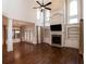 Open-concept living room with fireplace, built-in shelves, tall windows, and hardwood floors creates a bright and welcoming space at 1837 Haven Park Se Cir, Smyrna, GA 30080