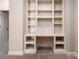 Custom built-in office space featuring shelving and desk in a neutral palette is perfect for working from home at 1837 Haven Park Se Cir, Smyrna, GA 30080