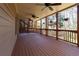 This covered porch features multiple ceiling fans and decorative hanging plants at 1837 Haven Park Se Cir, Smyrna, GA 30080