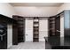 Large walk-in closet with custom shelving, an access door, and a safe at 1837 Haven Park Se Cir, Smyrna, GA 30080