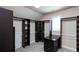 Spacious walk-in closet offers ample storage and organization with custom shelving and drawers at 1837 Haven Park Se Cir, Smyrna, GA 30080