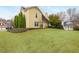 Exterior showcasing a well-maintained backyard with lush greenery and a charming home exterior at 2038 Drogheda Ln, Marietta, GA 30066