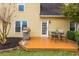 Backyard patio with outdoor dining set and grill, perfect for entertaining and relaxation at 2038 Drogheda Ln, Marietta, GA 30066