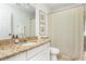 Bathroom featuring a vanity with granite countertop, an oval sink, and framed artwork at 2038 Drogheda Ln, Marietta, GA 30066