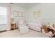 Charming Bedroom with crib, comfortable armchair, and plenty of natural light at 2038 Drogheda Ln, Marietta, GA 30066