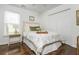 Cozy bedroom featuring hardwood floors, a double closet and a large window with natural light at 2038 Drogheda Ln, Marietta, GA 30066