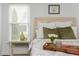 Comfortable bedroom featuring a plush bed with decorative pillows and a tray for a relaxing morning at 2038 Drogheda Ln, Marietta, GA 30066