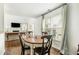 Bright dining area featuring hardwood floors, and large window providing plenty of natural light at 2038 Drogheda Ln, Marietta, GA 30066