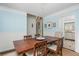 Charming dining room featuring blue walls, wood floors, and a view of the staircase and kitchen at 2038 Drogheda Ln, Marietta, GA 30066