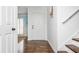 Bright foyer with hardwood floors featuring a decorative pattern, light walls, and staircase at 2038 Drogheda Ln, Marietta, GA 30066
