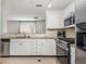 Well-lit kitchen featuring stainless steel appliances and granite countertops at 2038 Drogheda Ln, Marietta, GA 30066