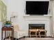Cozy living room featuring a fireplace with TV above at 2038 Drogheda Ln, Marietta, GA 30066