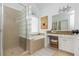 Main bathroom featuring a separate shower, soaking tub, granite vanity, and neutral colors at 2038 Drogheda Ln, Marietta, GA 30066
