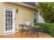 Cozy patio with wooden deck, outdoor seating, and a view of the landscaped backyard at 2038 Drogheda Ln, Marietta, GA 30066