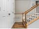 A view of the stairway with white railings and wood trim, leading to the upper level of the home at 2038 Drogheda Ln, Marietta, GA 30066