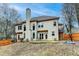 Rear view of home showcasing a spacious backyard, patio, and basketball hoop at 2730 Henderson Chase Ct, Tucker, GA 30084