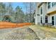 Large backyard with stone patio, outdoor furniture, and privacy fence at 2730 Henderson Chase Ct, Tucker, GA 30084