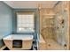 Bathroom with modern soaking tub, large shower, and a window view at 2730 Henderson Chase Ct, Tucker, GA 30084