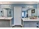 Bathroom with double sink vanity, large mirrors, and blue walls at 2730 Henderson Chase Ct, Tucker, GA 30084