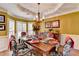 Elegant dining room featuring stylish furnishings, decorative lighting, and a bright atmosphere at 2730 Henderson Chase Ct, Tucker, GA 30084