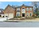 Charming two-story brick home with well-manicured landscaping and attached two-car garage at 2730 Henderson Chase Ct, Tucker, GA 30084
