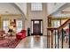 Bright foyer with hardwood floors, high ceilings, and a view of the living area at 2730 Henderson Chase Ct, Tucker, GA 30084