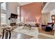 Inviting living room with high ceilings, a fireplace, and large windows for natural light at 2730 Henderson Chase Ct, Tucker, GA 30084