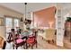 Cozy living room features fireplace, dining area, and large windows for natural light at 2730 Henderson Chase Ct, Tucker, GA 30084