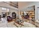 Open-concept living room and kitchen with hardwood floors and lots of natural light at 2730 Henderson Chase Ct, Tucker, GA 30084