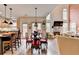 Open floor plan showcasing the kitchen, dining area, and living room with a fireplace at 2730 Henderson Chase Ct, Tucker, GA 30084