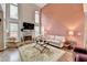 Bright living room with fireplace, high ceilings, large windows, and comfortable seating at 2730 Henderson Chase Ct, Tucker, GA 30084