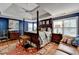 Spacious main bedroom with four post bed and sitting area with hardwood floors at 2730 Henderson Chase Ct, Tucker, GA 30084