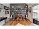 Hardwood floored office with desk and chair surrounded by wall pictures at 2730 Henderson Chase Ct, Tucker, GA 30084