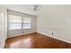 This bedroom boasts hardwood floors and a ceiling fan at 3702 Chesapeake Way, Atlanta, GA 30344