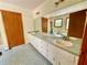 Bathroom featuring a double vanity and decorative blue tiled floor at 610 Coolsprings Ln, Woodstock, GA 30188