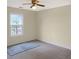 Bedroom featuring a ceiling fan, a window, and neutral finishes at 610 Coolsprings Ln, Woodstock, GA 30188