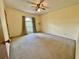 Spacious carpeted bedroom featuring a window and neutral wall color at 610 Coolsprings Ln, Woodstock, GA 30188