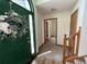 Inviting entryway with a decorative wreath on a green door and hardwood flooring at 610 Coolsprings Ln, Woodstock, GA 30188