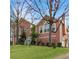 Charming two-story home with a lush green lawn and attractive landscaping, creating a welcoming curb appeal at 610 Coolsprings Ln, Woodstock, GA 30188
